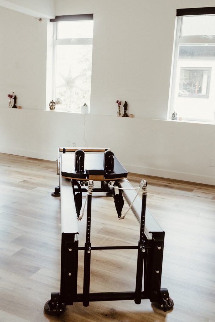 A pilates reformer installed in the light and bright Embodied studio