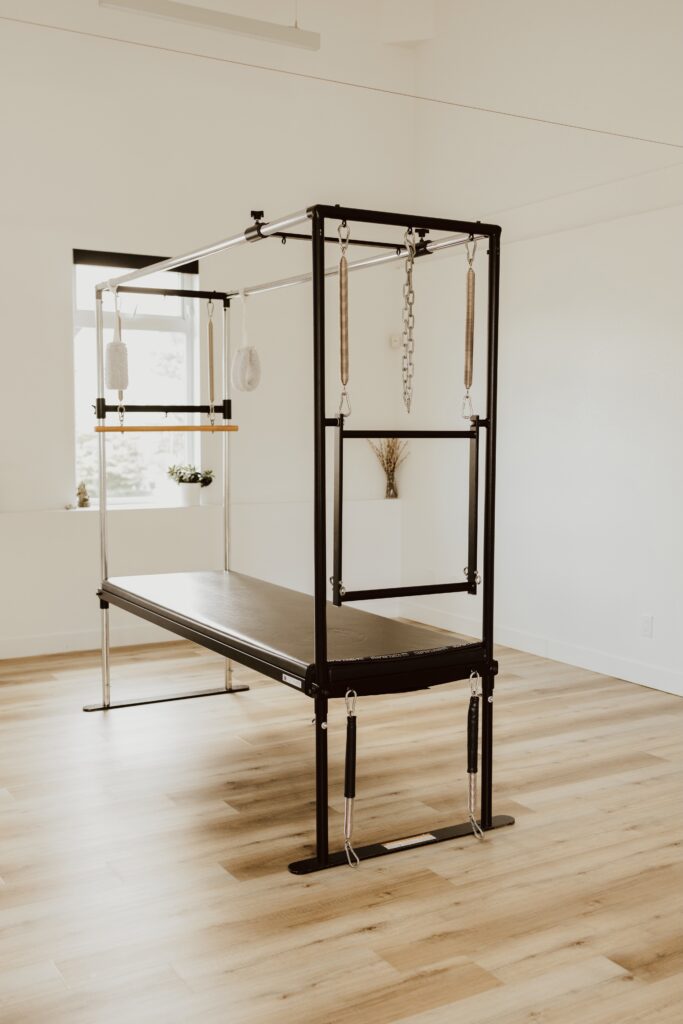 A pilates cadillac installed in the light and bright Embodied studio